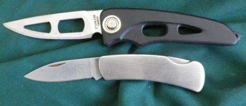 Two Folders. Lock blades, One with Spider on Blade
