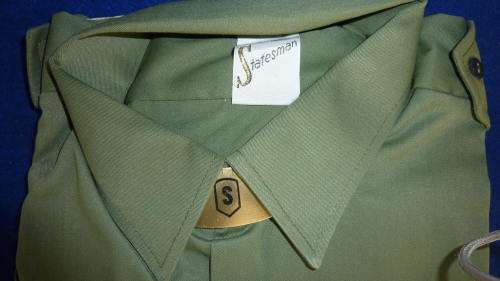 4B) 1970'S- RHODESIAN ARMY-OLIVE DRAPE-SHORT SLEEVE SHIRT-AS NEW-(STILL HAS CARDBOARD)-SIZE 41!