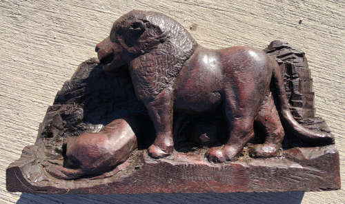 AFRICAN WOOD CARVING OF A LION OVER A KILL