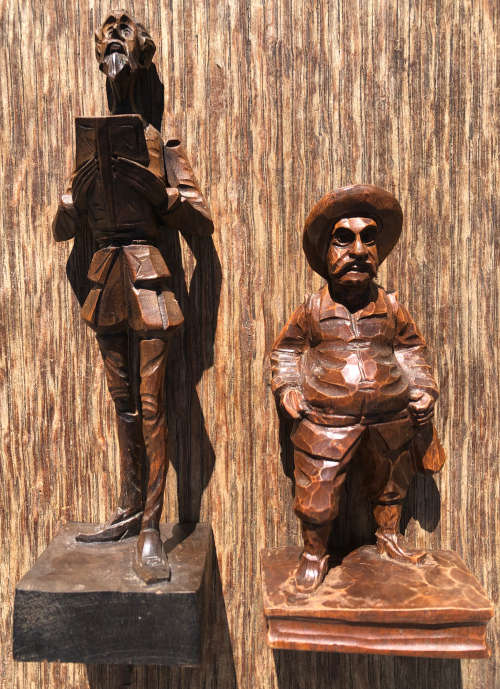 PAIR OF WOOD CARVED FIGURES OF DON QUIXOTE AND SANCHO PANZA SIGNED OURO ARTESANIA