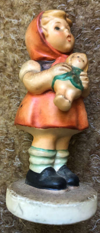 HUMMEL FIGURINE OF GIRL HOLDING DOLL