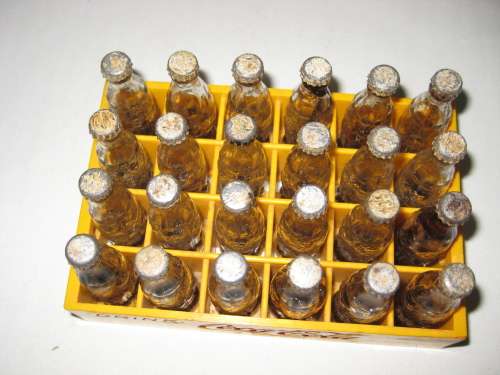Coca-Cola 24 Miniatures Bottles with lids in Plastic crate