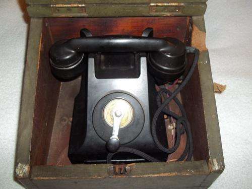 Very old (nommer asb!) Ericson made in England telephone mounted in wooden box