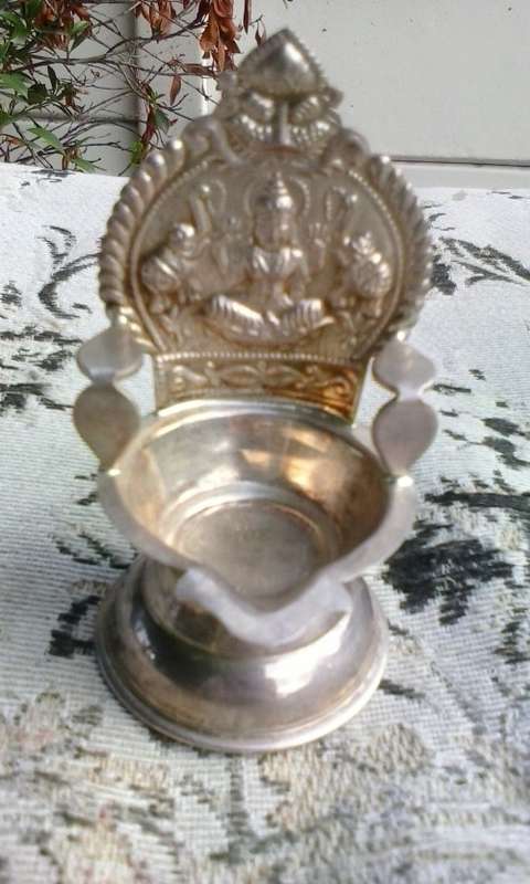 Silver coloured metal Hindu oil burner, stamped VBJ 925, 8cm high, small crack at the back.