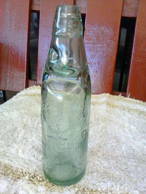 Glass bottle with marble inside, Crystal Springs Johannesburg, 23cm