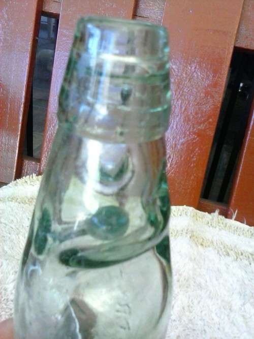 Glass bottle with marble inside, Crystal Springs Johannesburg, 23cm