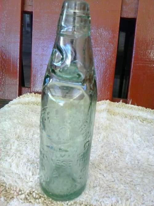 Glass bottle with marble inside, Crystal Springs Johannesburg, 23cm