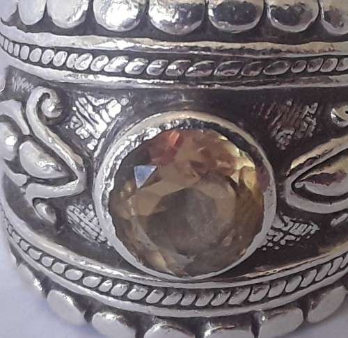 Solid sterling silver wide band ring with faceted citrine coloured stone.  Size: O.  Weight: 13.6g
