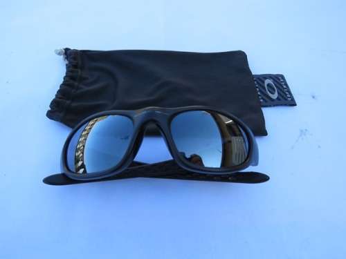 Oakley  sunglasses, authentic and with branded dust cloth bag. Made in USA.