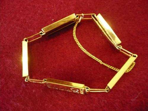 VINTAGE BANGLE IN THE FORM OF GOLD SLATES WITH WORDING "SOUTH AFRICAN GOLD COMPANY"