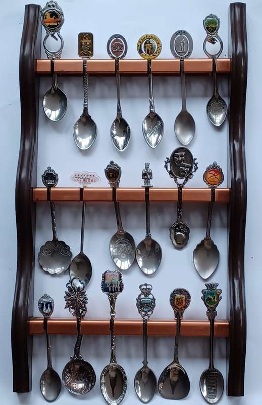 Vintage  collectable spoons on wall stand