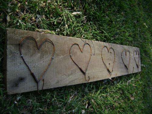5 rusted heart hooks on reclaimed wood