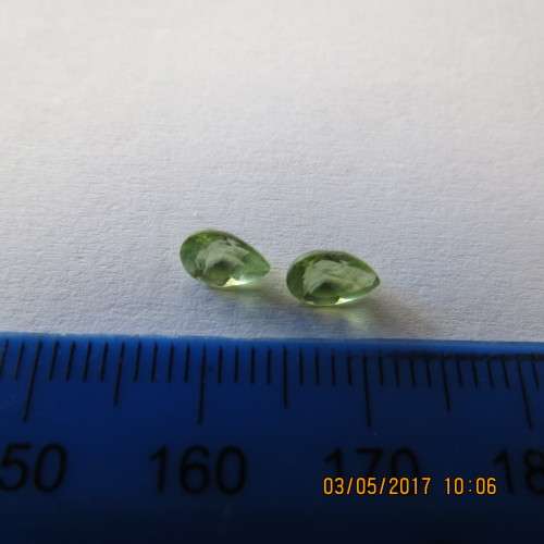 Two Peridot semi-precious stones, as per photo