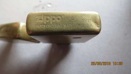 Zippo lighter marked solid brass, pin on flap replaced with piece of wire,  as per photo