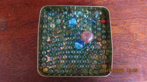 tin of old marbles and goons, 149 marbles and 5 goons, as per photo