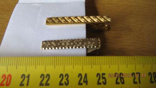 two gold plated tie pins, as per photo