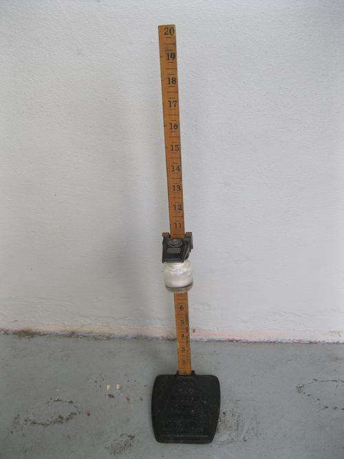 VINTAGE CAST IRON AND WOODEN SKIRT MARKER
