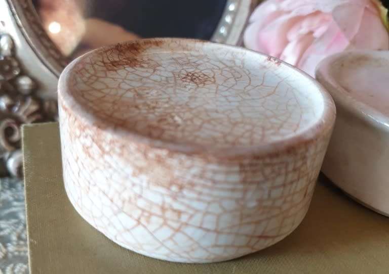 Antique porcelain toothpaste holders |