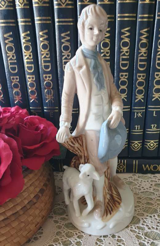 Beautiful vintage porcelain figurine of a young Lad with a lamb