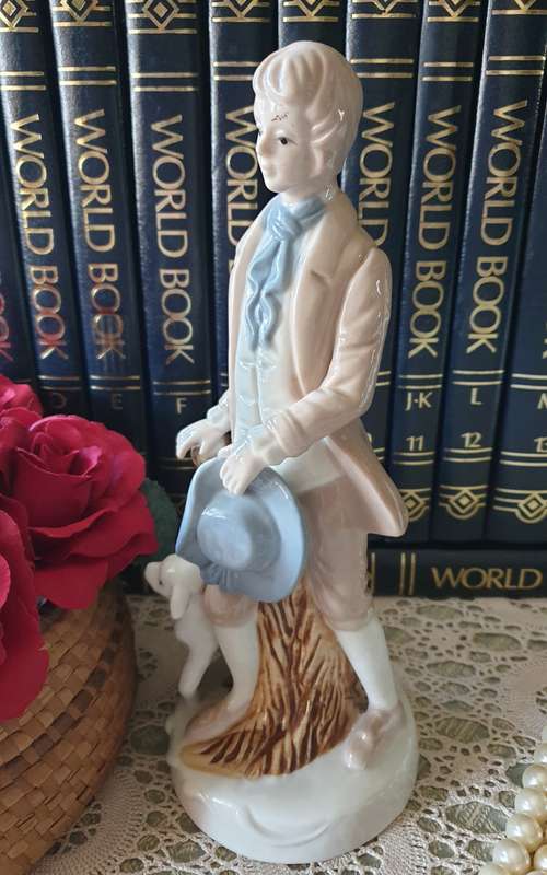 Beautiful vintage porcelain figurine of a young Lad with a lamb