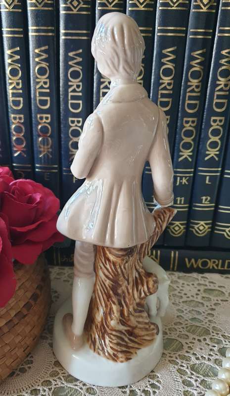Beautiful vintage porcelain figurine of a young Lad with a lamb