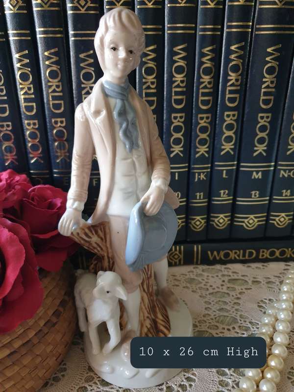 Beautiful vintage porcelain figurine of a young Lad with a lamb