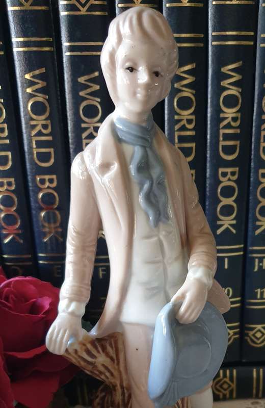 Beautiful vintage porcelain figurine of a young Lad with a lamb