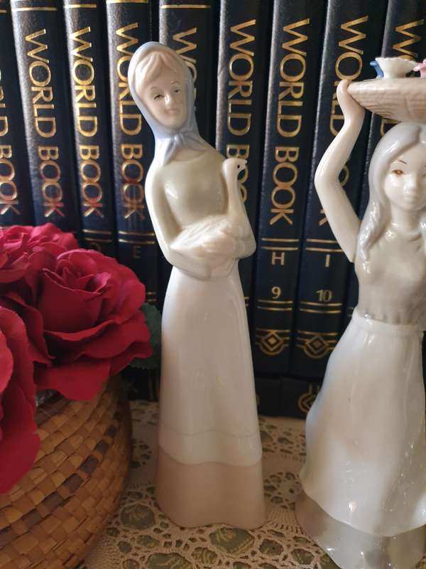 Beautiful vintage porcelain figurines of  young Ladies