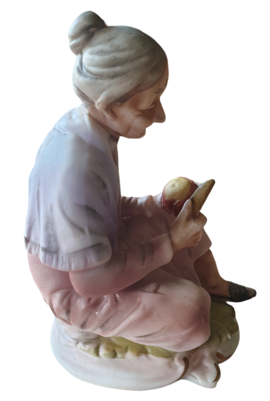 Vintage Ceramic Elderly Woman Sitting Peeling An Apple | Bisque Porcelain |