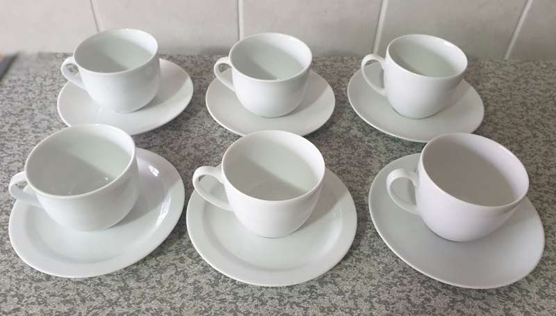 TEA CUPS AND SAUCERS