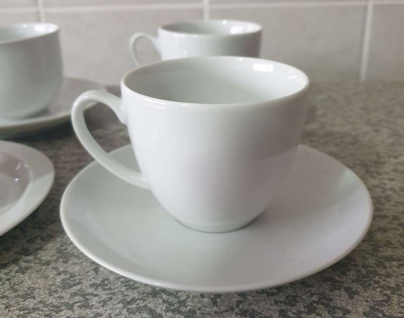 TEA CUPS AND SAUCERS