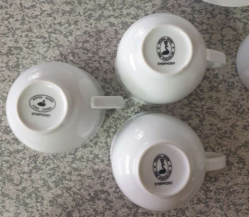 TEA CUPS AND SAUCERS