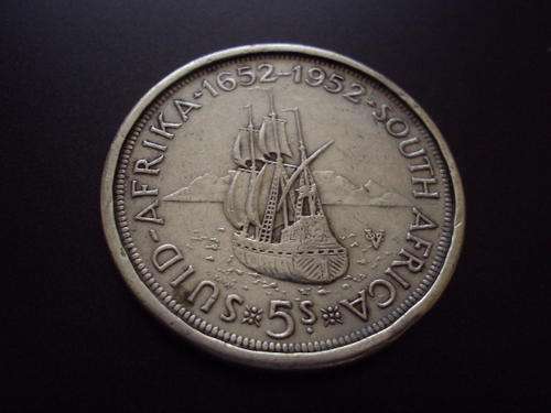 A 1952 silver crown coin infused in a silver ring.