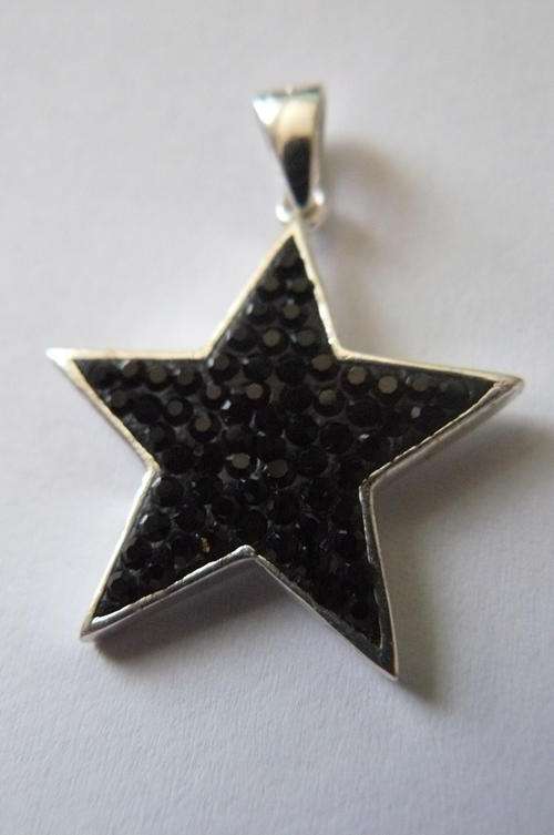 SILVER STAR PENDANT STAMPED WITH SOME BLACK BLING