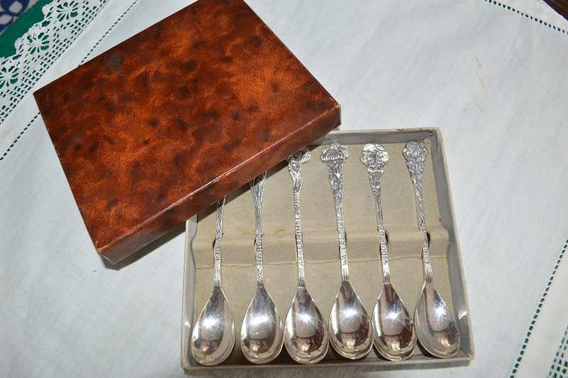 6 silver plated demitasse teaspoons with a different flower on the end of each handle,Very pretty !