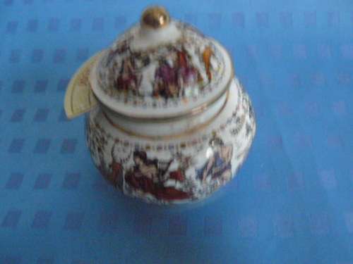 OPIUM CERAMIC PERFUME BOTTLE SOME CONTENTS