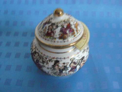 OPIUM CERAMIC PERFUME BOTTLE SOME CONTENTS