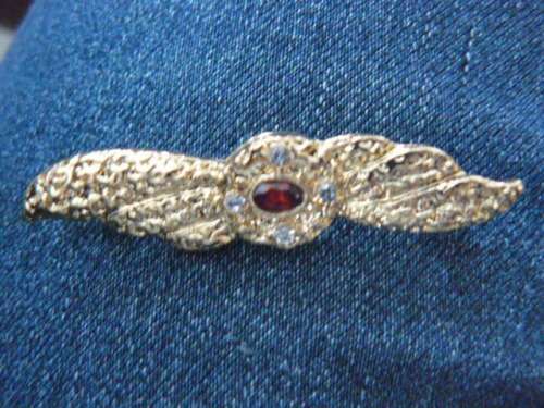 BROOCH WITH RED STONE