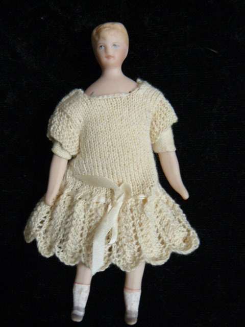 STUNNING MINIATURE PORCELAIN DOLL WITH HAND MADE DRESS