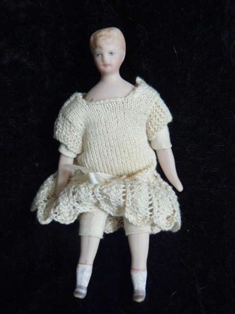 STUNNING MINIATURE PORCELAIN DOLL WITH HAND MADE DRESS