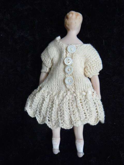 STUNNING MINIATURE PORCELAIN DOLL WITH HAND MADE DRESS