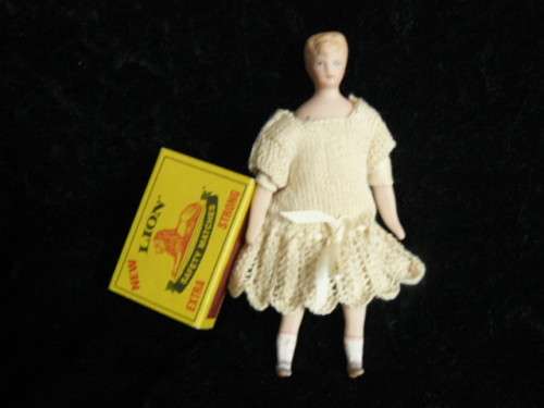 STUNNING MINIATURE PORCELAIN DOLL WITH HAND MADE DRESS