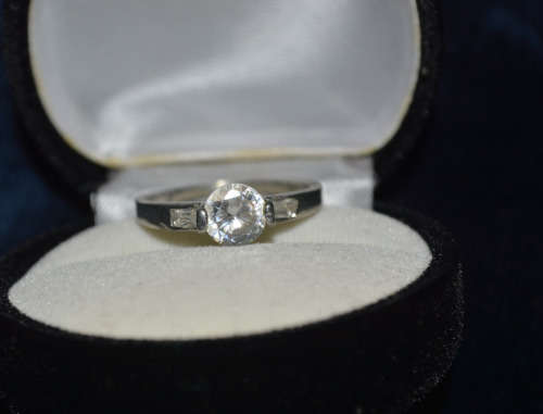 SILVER TONED RING WITH CLEAR STONE