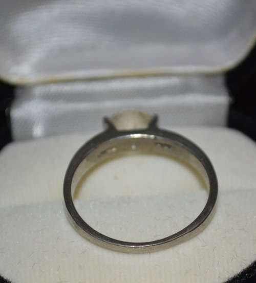 SILVER TONED RING WITH CLEAR STONE