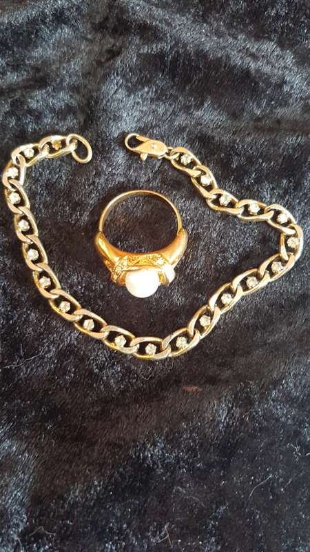Gorgeous gold toned bracelet with shinny crystals and pearls and a large crystal ring
