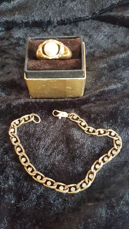 Gorgeous gold toned bracelet with shinny crystals and pearls and a large crystal ring