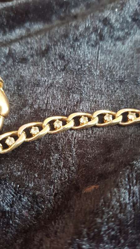 Gorgeous gold toned bracelet with shinny crystals and pearls and a large crystal ring