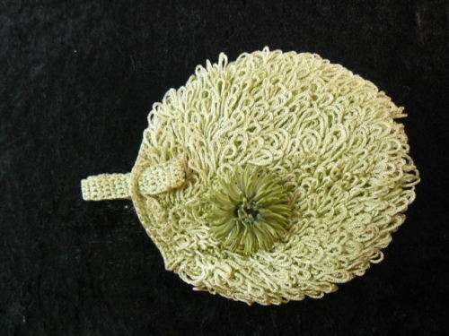 INTERESTING WRIST BAG AND FREE BROOCH