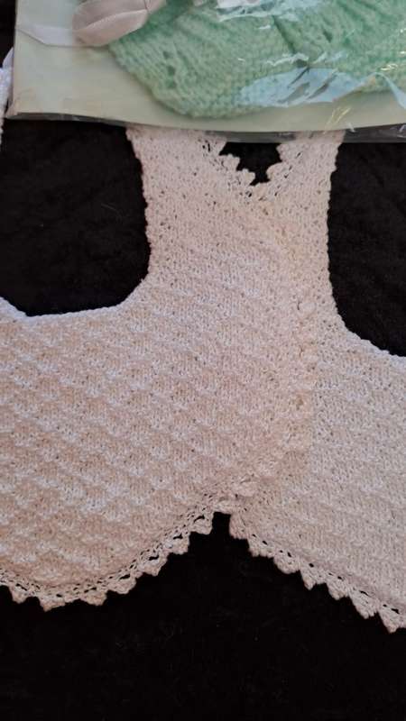 2 double layer vintage crotcheted cotton bibs and a pair of booties