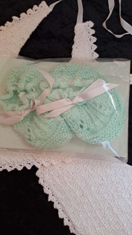 2 double layer vintage crotcheted cotton bibs and a pair of booties